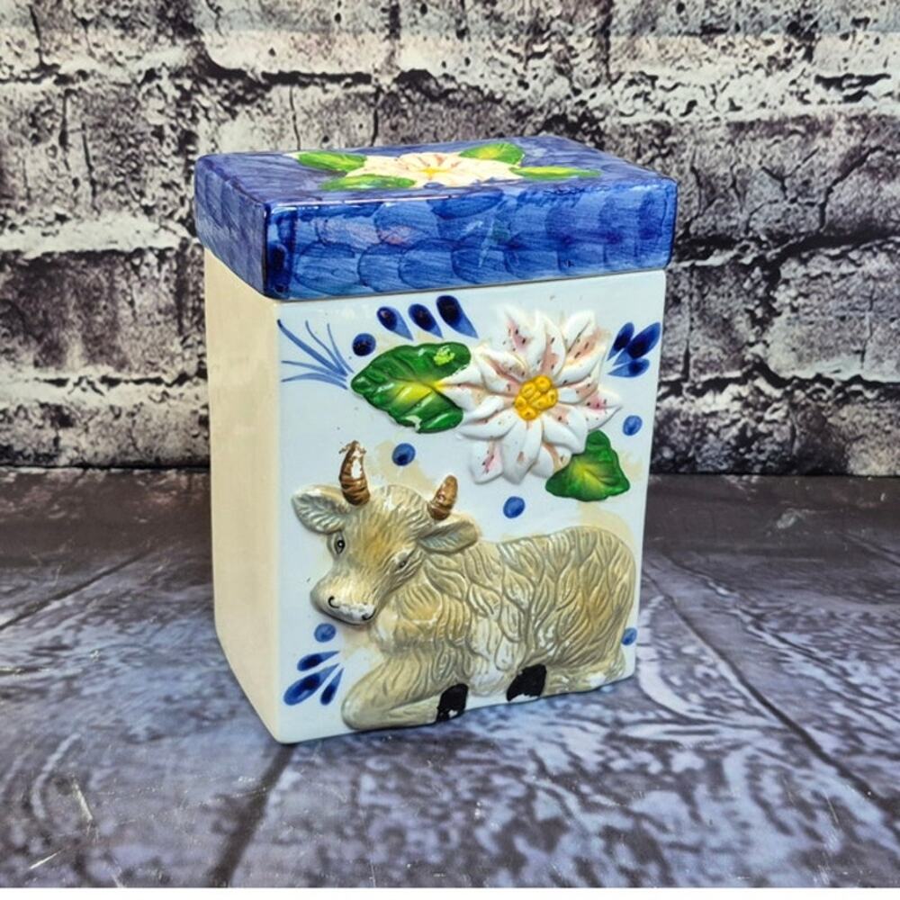 Vintage Ceramic Cow Canister with Floral Design and blue lid
